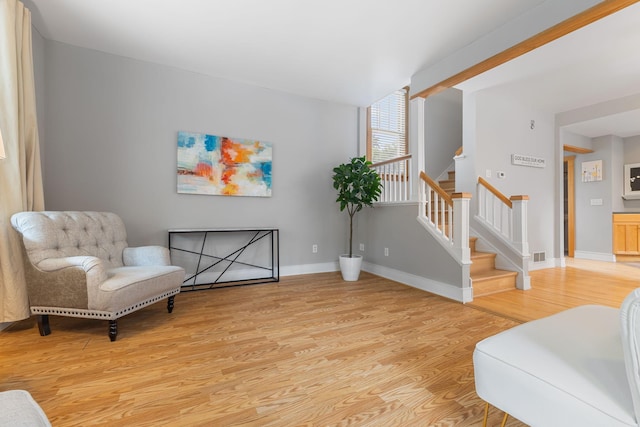 1096 14th Ave SE, Minneapolis, MN 55414 - living area featuring light wood-style floors and stairway