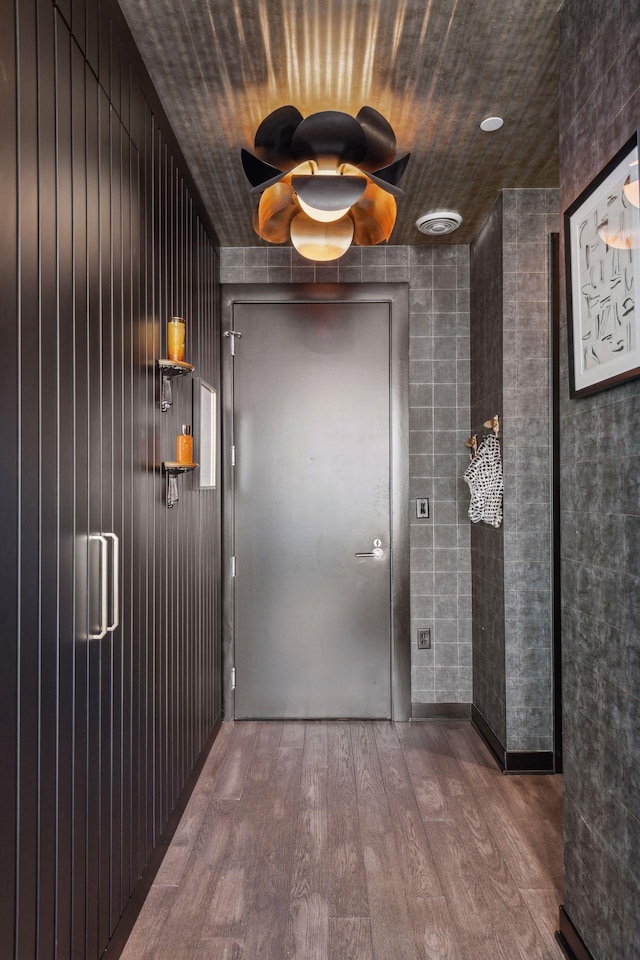 interior space featuring hardwood / wood-style floors and wooden ceiling