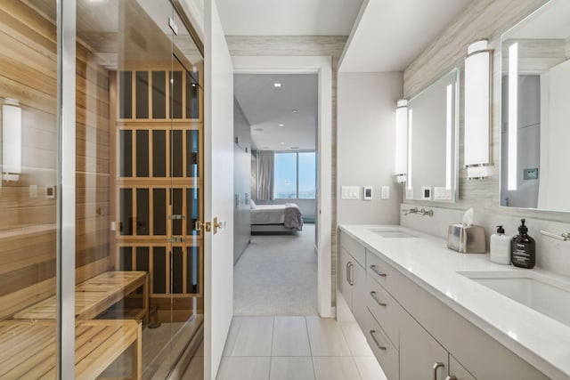 bathroom with tile patterned flooring, vanity, and tasteful backsplash