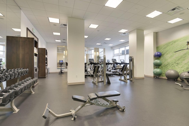 gym featuring a paneled ceiling