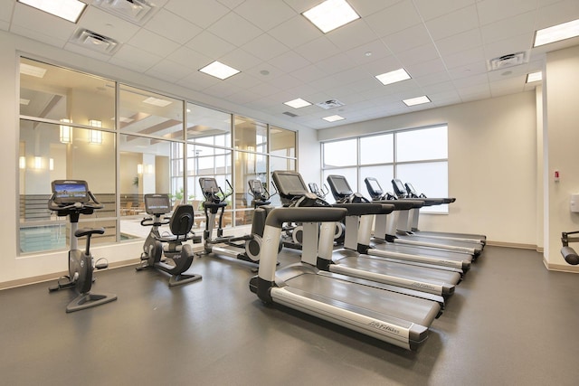 workout area featuring a paneled ceiling