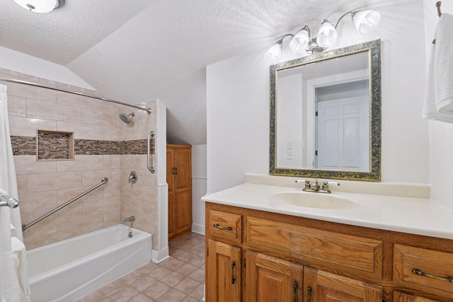 full bathroom featuring a textured ceiling, vanity, shower / bath combination with curtain, vaulted ceiling, and tile patterned flooring