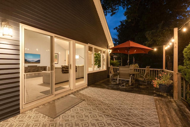 patio at twilight with outdoor dining space