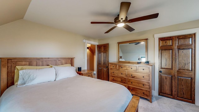 bedroom featuring ceiling fan, light colored carpet, and lofted ceiling