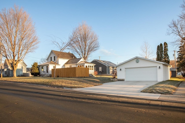 single story home featuring an outdoor structure and a garage