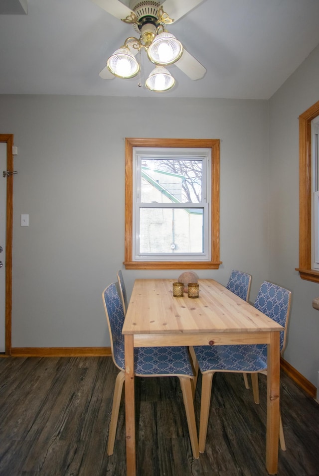 dining area featuring dark hardwood / wood-style flooring and ceiling fan