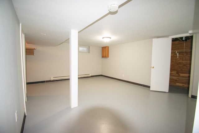 basement featuring a baseboard heating unit