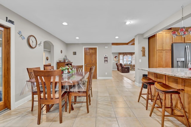 dining space with light tile patterned floors