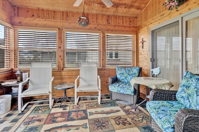 sunroom featuring ceiling fan, a healthy amount of sunlight, and wood ceiling