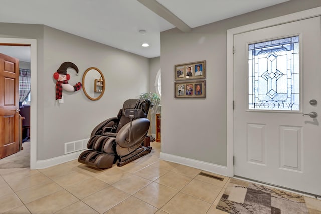 foyer featuring light tile patterned floors