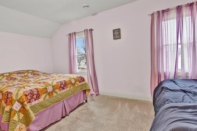 bedroom with light carpet and vaulted ceiling