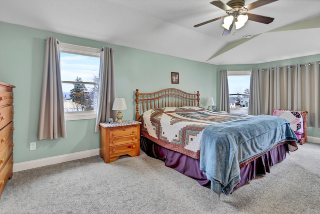 carpeted bedroom featuring ceiling fan and vaulted ceiling