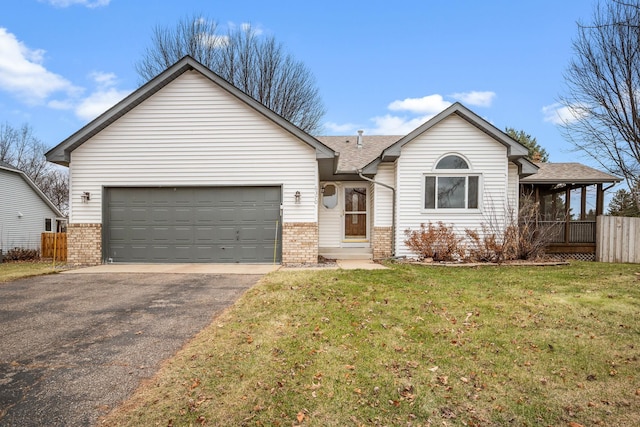 single story home featuring a front yard and a garage