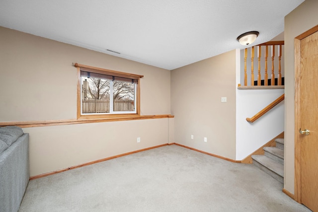 empty room with light colored carpet