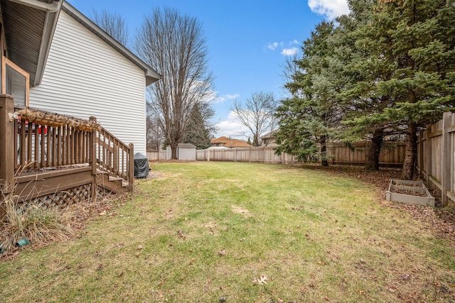 view of yard with a wooden deck