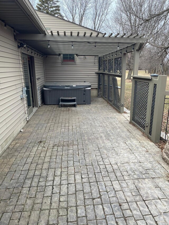 view of patio with a hot tub