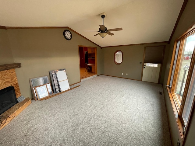 unfurnished living room featuring ceiling fan, carpet floors, and lofted ceiling