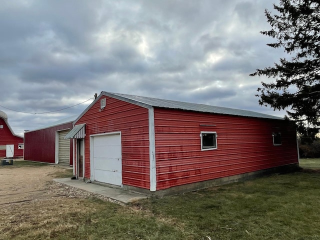 view of outbuilding with a garage