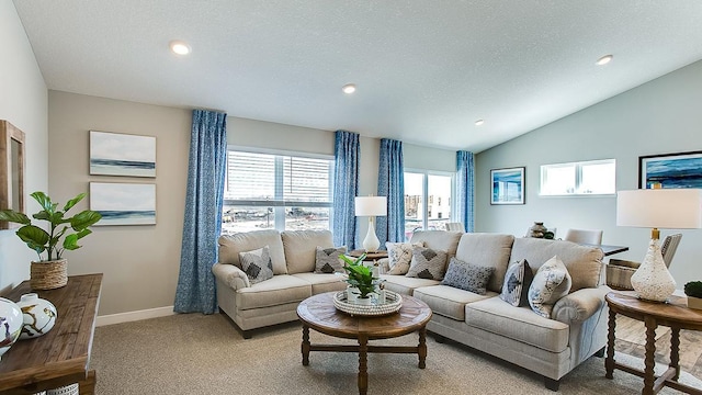 carpeted living room featuring vaulted ceiling and a textured ceiling