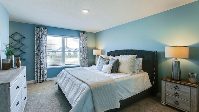 bedroom with dark carpet