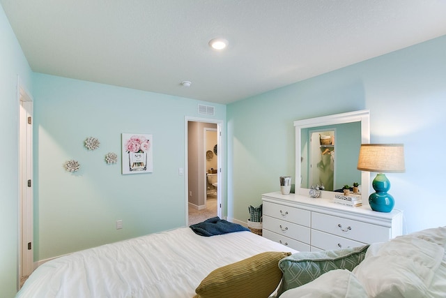 bedroom featuring light colored carpet