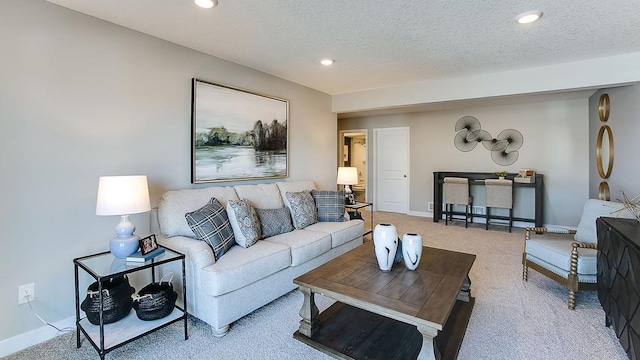 carpeted living room with a textured ceiling