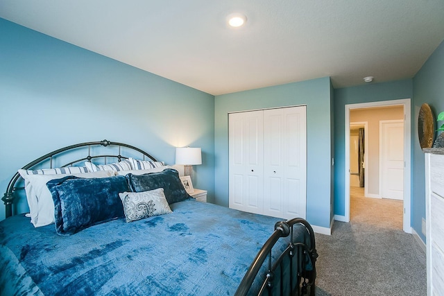 bedroom featuring carpet and a closet