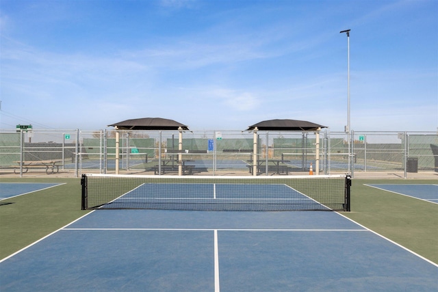 view of sport court featuring basketball hoop