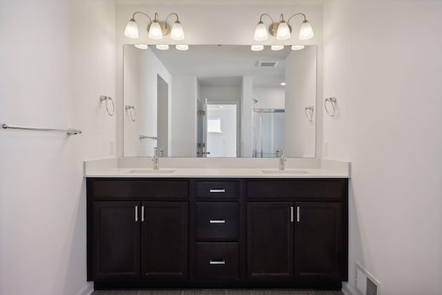 bathroom with a shower and vanity