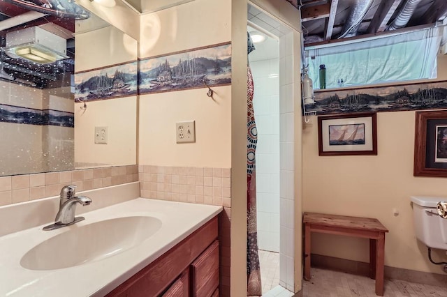 bathroom with toilet and vanity