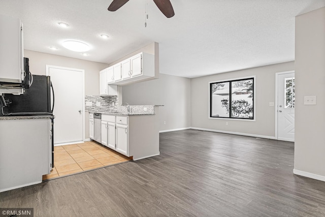 kitchen featuring a textured ceiling, ceiling fan, light hardwood / wood-style flooring, dishwasher, and white cabinetry