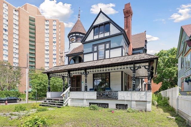 view of front of house with a front lawn and a porch