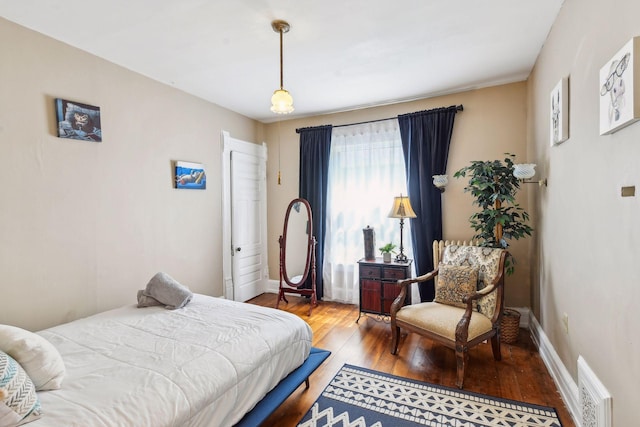 bedroom with wood-type flooring