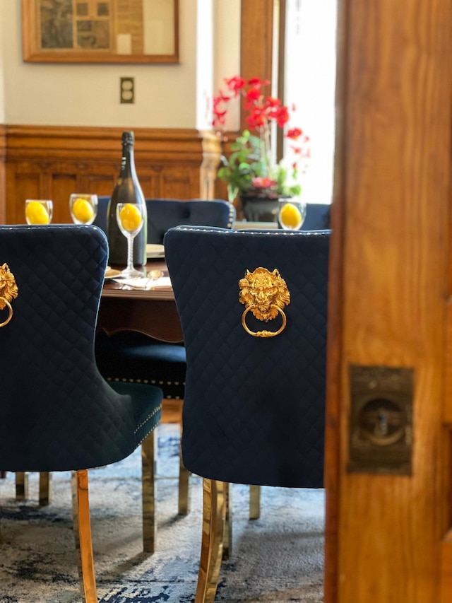 dining space featuring wainscoting