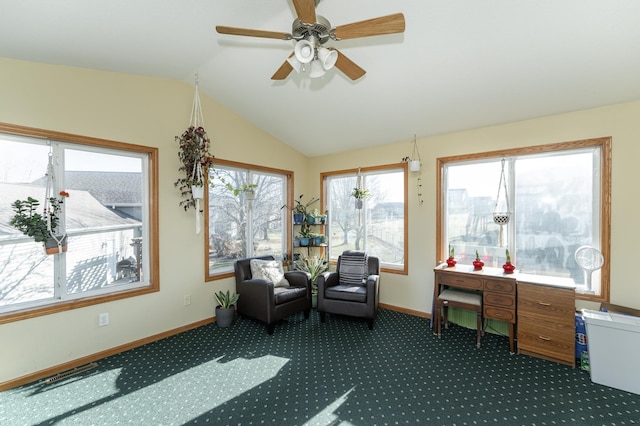 sunroom featuring lofted ceiling and ceiling fan