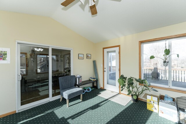 sunroom featuring lofted ceiling, plenty of natural light, and ceiling fan