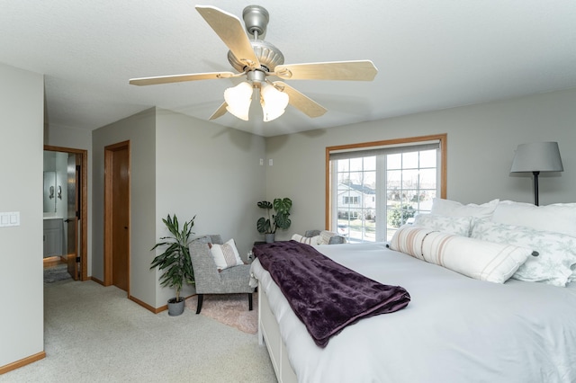 bedroom with ceiling fan and light carpet