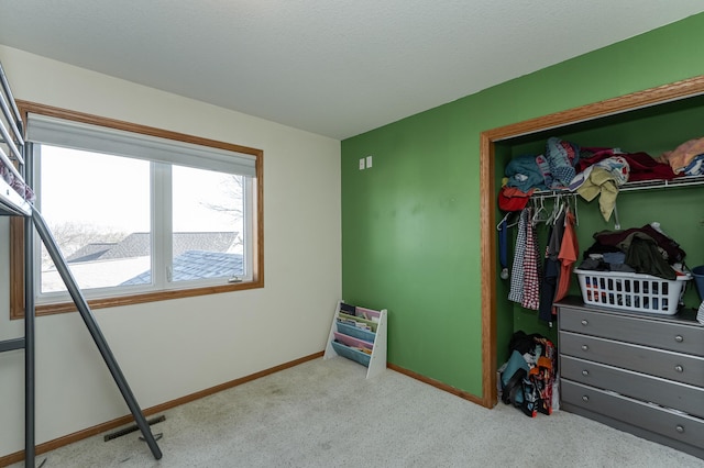 carpeted bedroom with multiple windows