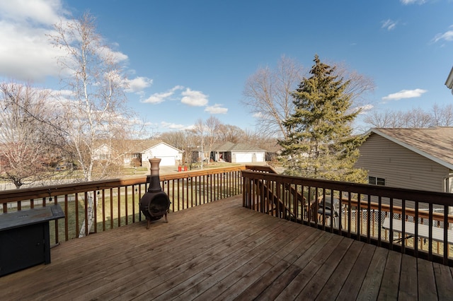 wooden terrace with a garage