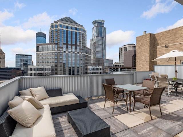 view of patio with outdoor lounge area and a balcony