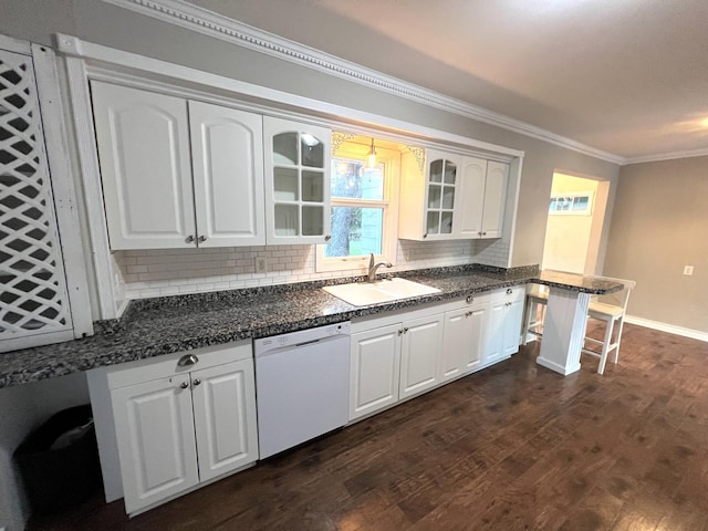 kitchen featuring white dishwasher, white cabinetry, and sink