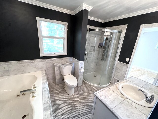 full bathroom with tile patterned flooring, vanity, ornamental molding, and tile walls