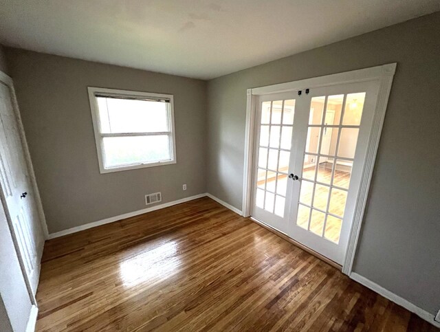 interior space featuring french doors and hardwood / wood-style flooring