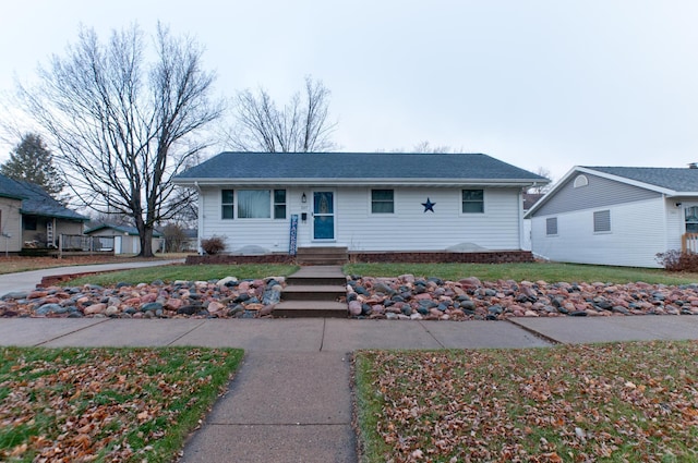 ranch-style house featuring a front lawn