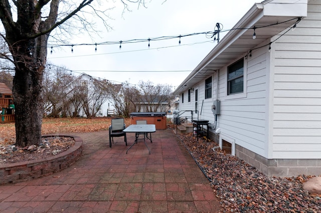 view of patio / terrace with a hot tub