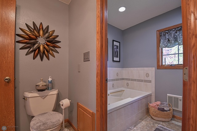 429 Bridge Ave, Warren, MN 56762 - bathroom featuring a garden tub and toilet