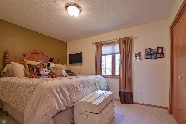 429 Bridge Ave, Warren, MN 56762 - bedroom featuring light colored carpet, a textured ceiling, and a closet