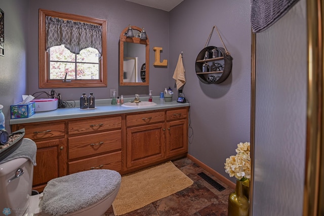 429 Bridge Ave, Warren, MN 56762 - bathroom featuring stone finish floors and vanity