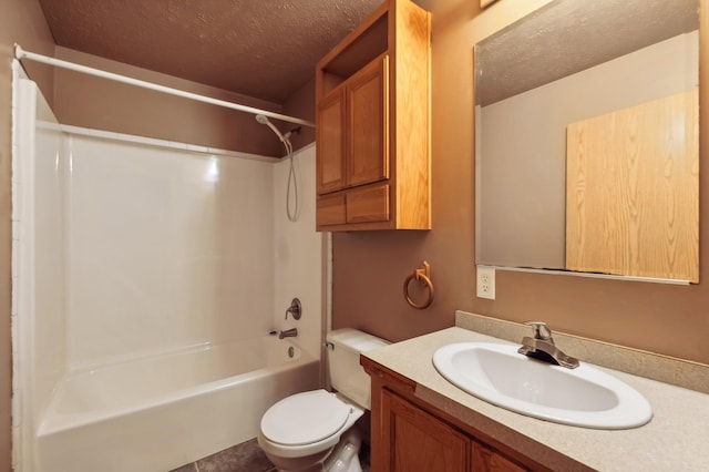 63219 Great River Rd, Jacobson, MN 55752 - full bathroom with vanity, toilet, a textured ceiling, and bathing tub / shower combination