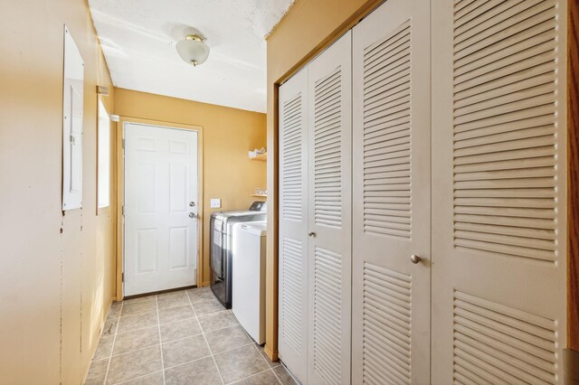 63219 Great River Rd, Jacobson, MN 55752 - washroom with washer and dryer and light tile patterned flooring